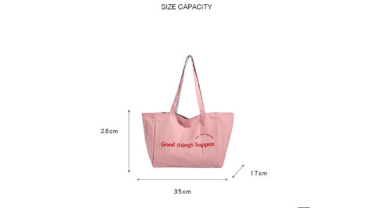 Reversible striped shoulder bag