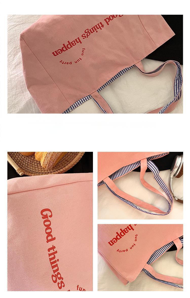 Reversible striped shoulder bag