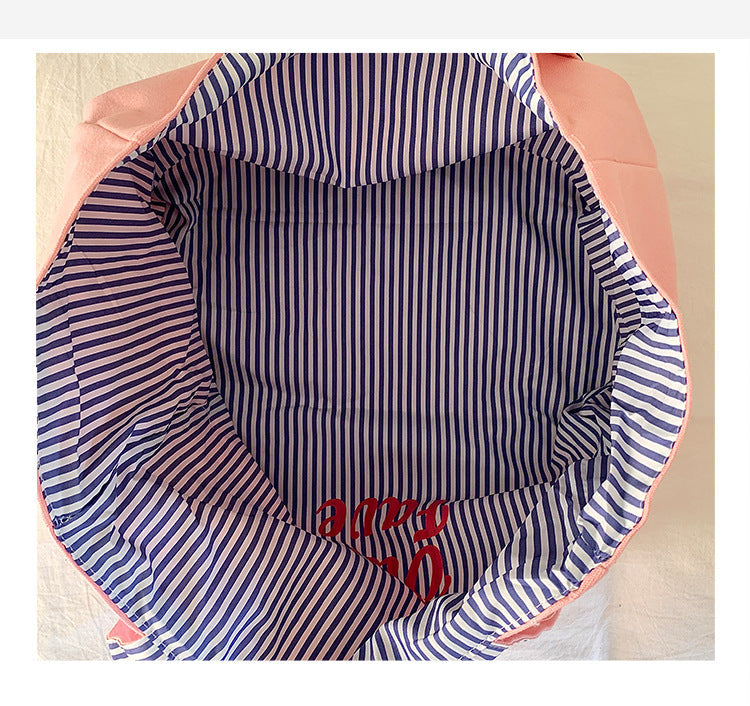 Reversible striped shoulder bag