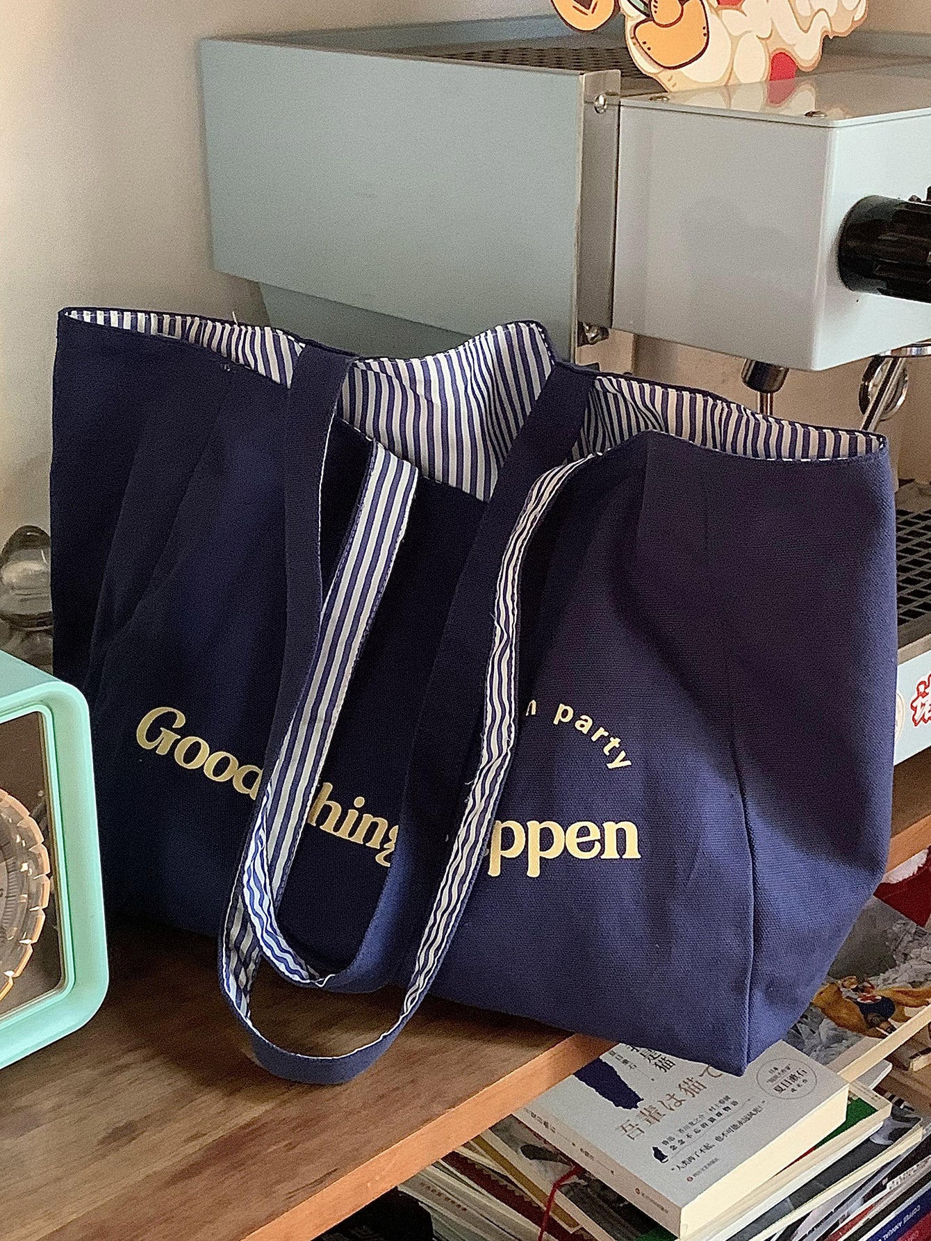 Reversible striped shoulder bag