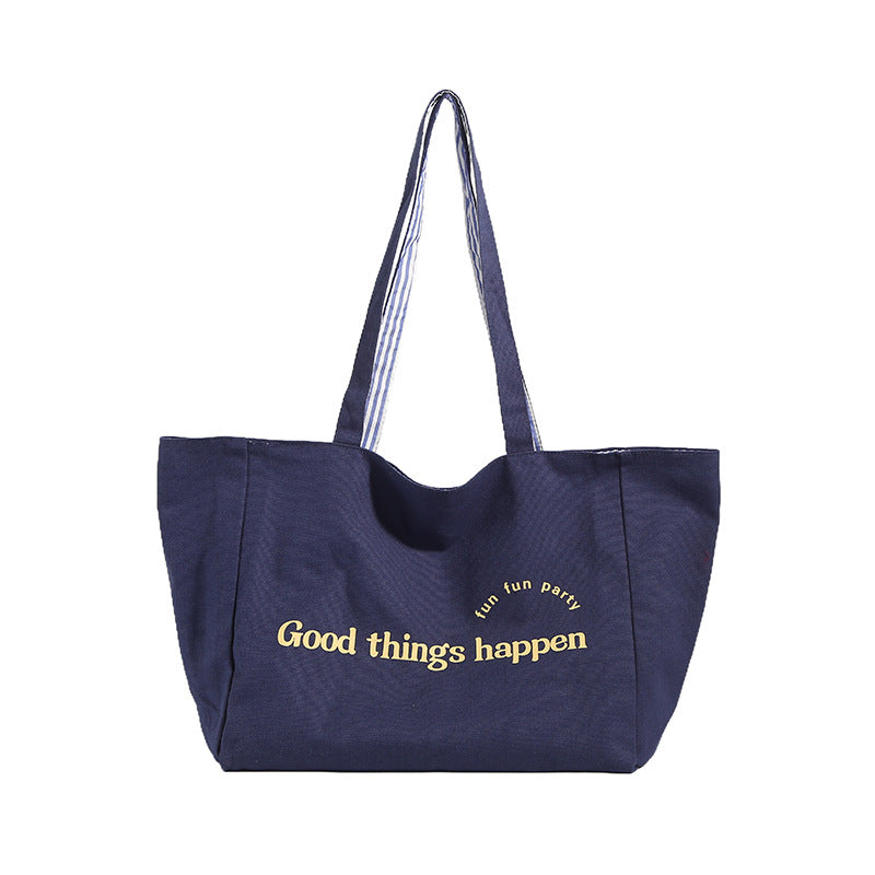 Reversible striped shoulder bag